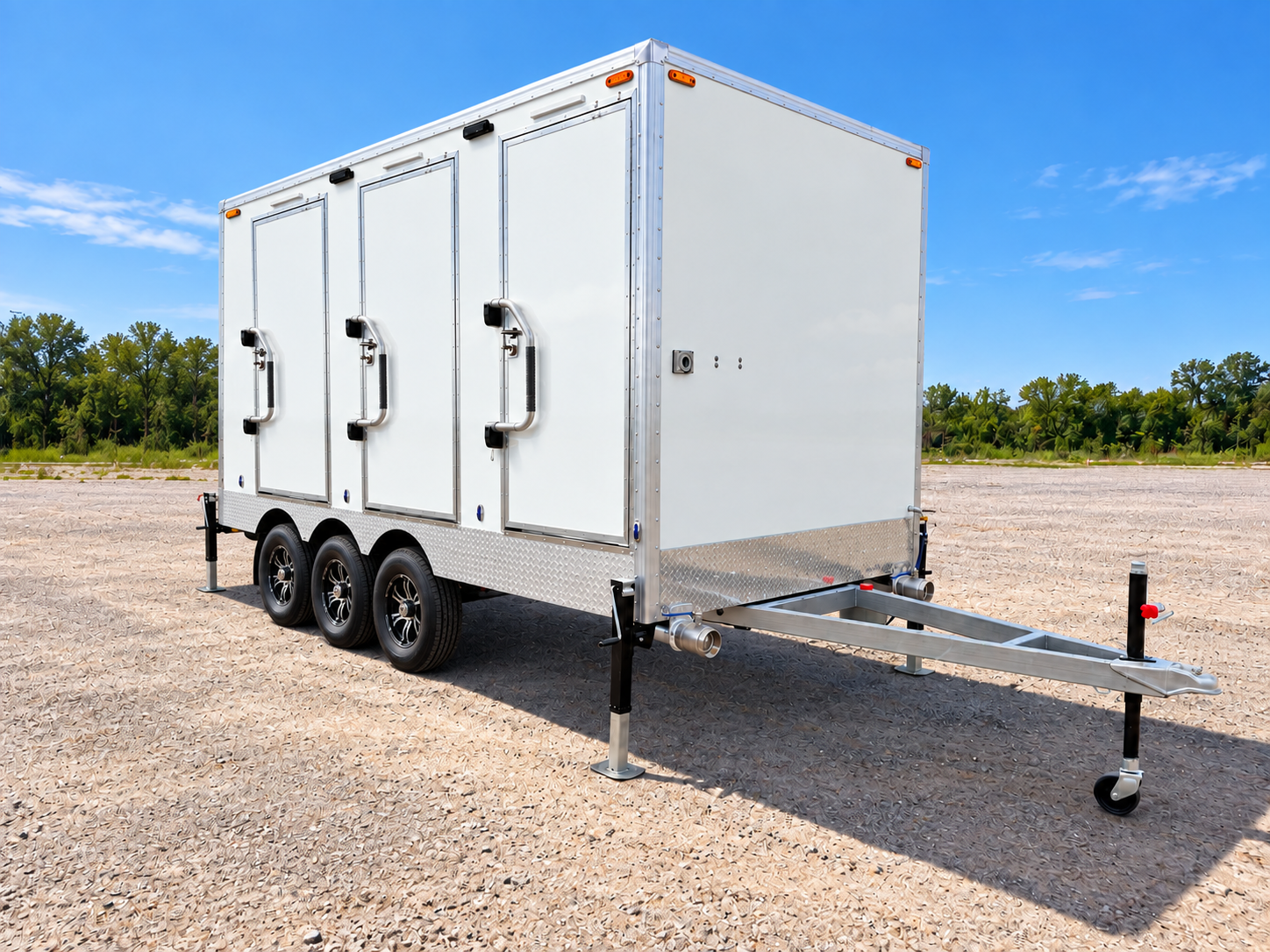 White shower and restroom combination trailer with three exterior entry doors