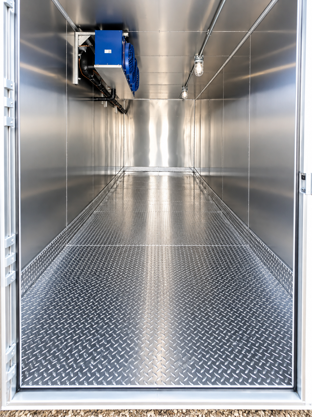 Empty insulated refrigerated trailer interior with cooling hardware